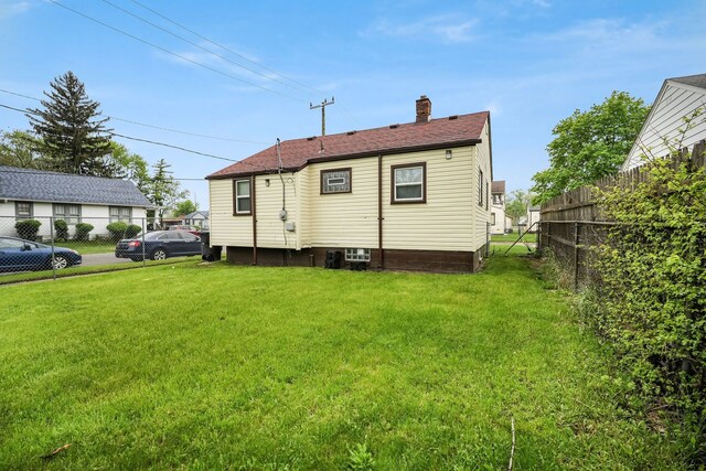 rear view of property with a chimney