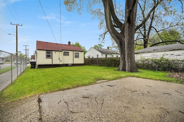 rear view of house featuring a chimney