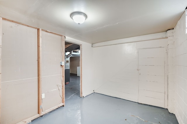 unfinished below grade area with concrete block wall