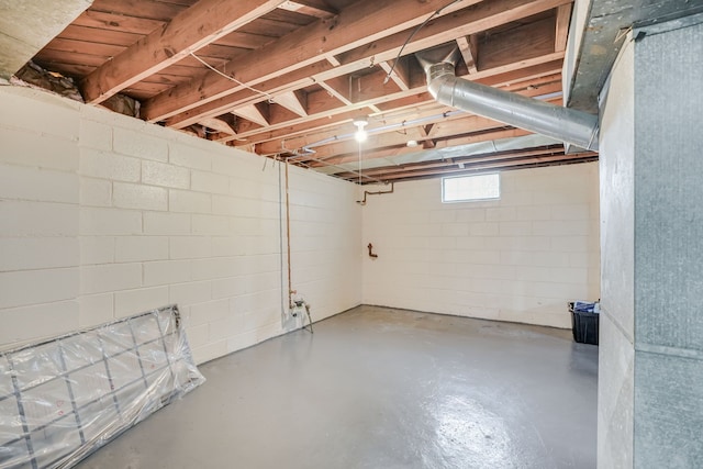 basement featuring concrete block wall