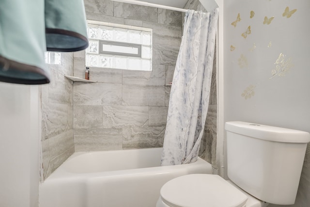 bathroom with toilet and shower / tub combo
