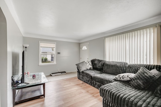 living room featuring light wood-style flooring and baseboards
