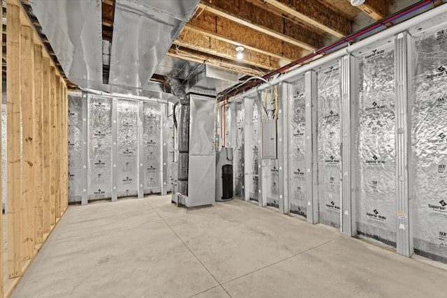 unfinished basement with heating unit and electric panel