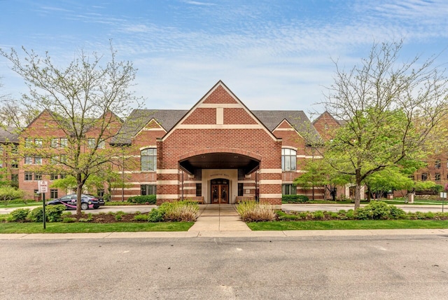 view of front of property featuring french doors and brick siding