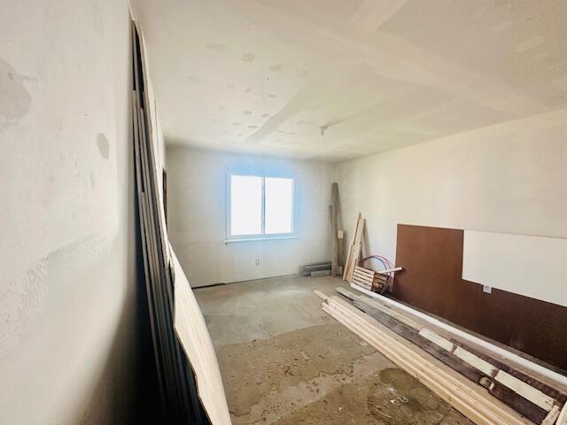 505 Ramsdell St, Manistee, MI 49660 - spare room featuring concrete floors