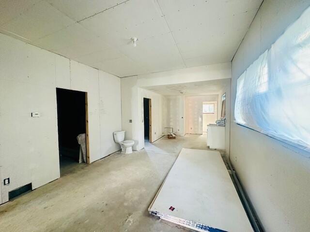 505 Ramsdell St, Manistee, MI 49660 - hall with unfinished concrete flooring