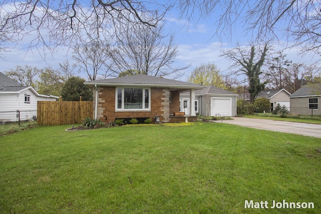 view of front of home featuring concrete driveway, a front yard, an attached garage, and fence