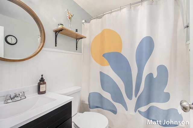 bathroom with vanity, toilet, and a shower with shower curtain