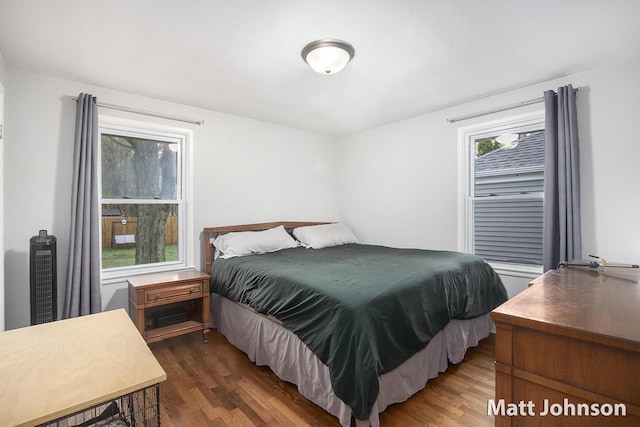 bedroom featuring dark wood finished floors