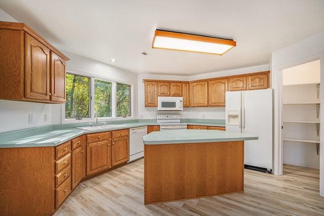 44811 Paw Paw Rd, Paw Paw, MI 49079 - kitchen with a center island, light wood-style flooring, a sink, and white appliances