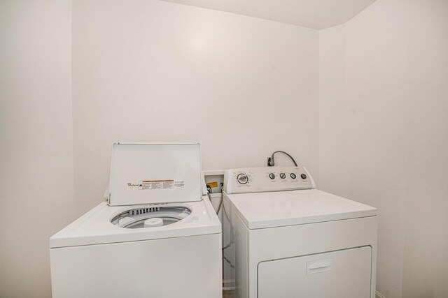 44811 Paw Paw Rd, Paw Paw, MI 49079 - laundry room with washing machine and clothes dryer and laundry area