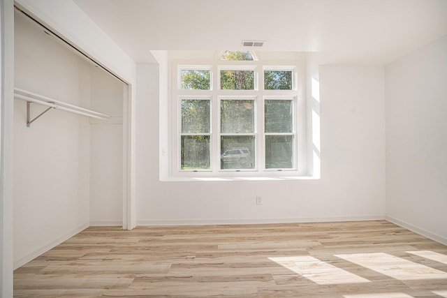 44811 Paw Paw Rd, Paw Paw, MI 49079 - spacious closet featuring light wood-style flooring and visible vents