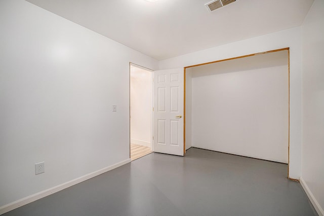 44811 Paw Paw Rd, Paw Paw, MI 49079 - unfurnished bedroom with baseboards, visible vents, and concrete flooring