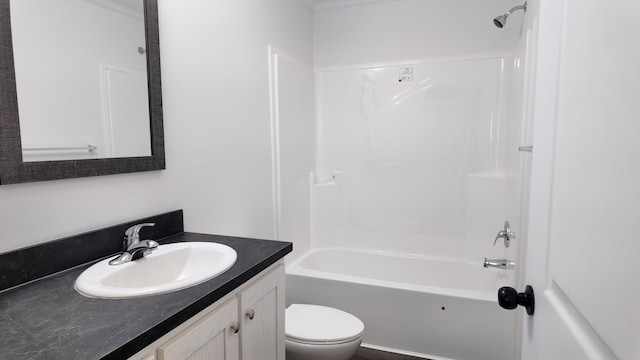 full bathroom featuring vanity, toilet, bathtub / shower combination, and ornamental molding