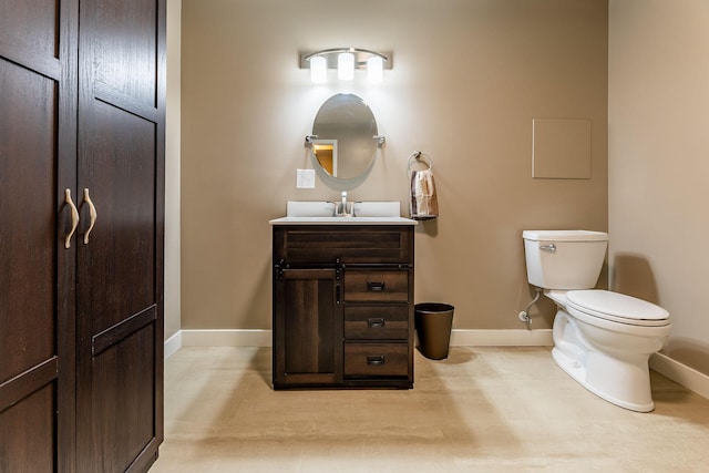 9379 Cook St, Montague, MI 49437 - bathroom with baseboards, vanity, and toilet