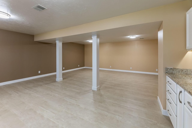9379 Cook St, Montague, MI 49437 - finished basement with baseboards and light wood finished floors