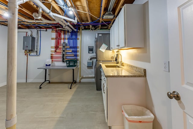 9379 Cook St, Montague, MI 49437 - below grade area with tankless water heater and a sink