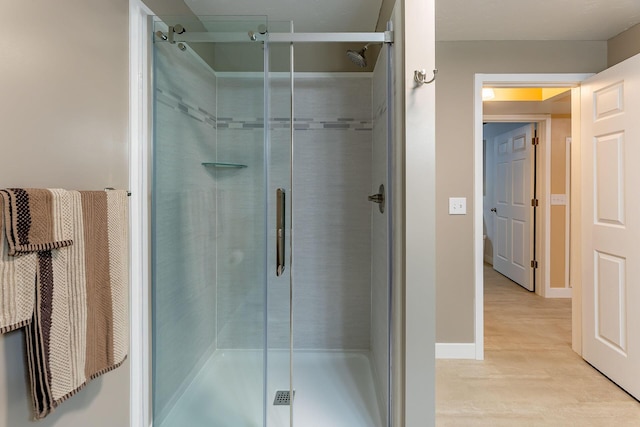 9379 Cook St, Montague, MI 49437 - full bathroom with a stall shower and wood finished floors