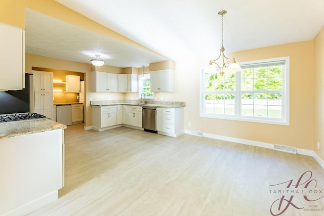 9379 Cook St, Montague, MI 49437 - kitchen featuring a sink, appliances with stainless steel finishes, healthy amount of natural light, and light wood-style floors