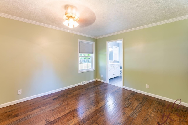 9379 Cook St, Montague, MI 49437 - spare room with ceiling fan, a textured ceiling, dark wood finished floors, baseboards, and ornamental molding
