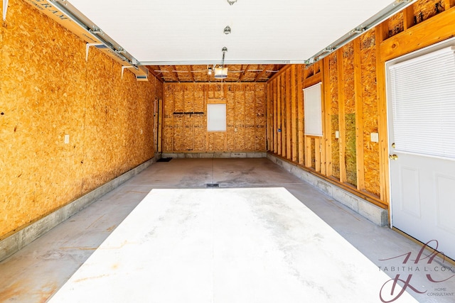 9379 Cook St, Montague, MI 49437 - garage featuring a garage door opener