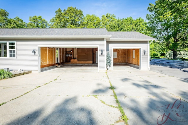 9379 Cook St, Montague, MI 49437 - garage with concrete driveway