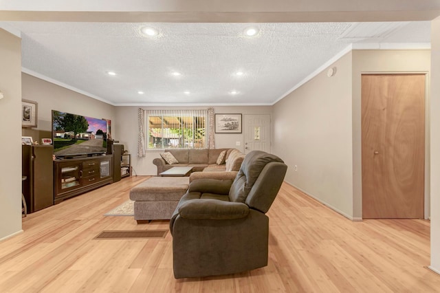 living area with crown molding, light wood-style flooring, recessed lighting, and a textured ceiling