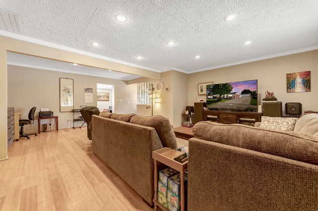 living area with light wood-type flooring, a textured ceiling, ornamental molding, recessed lighting, and an office area
