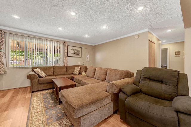 living room with a textured ceiling, light wood-style floors, crown molding, and recessed lighting
