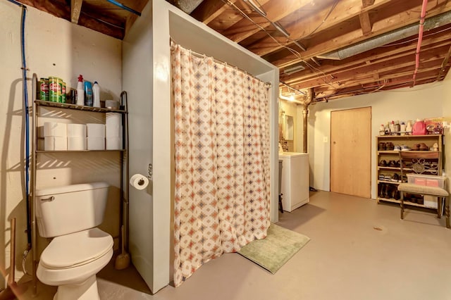unfinished below grade area featuring washer / dryer