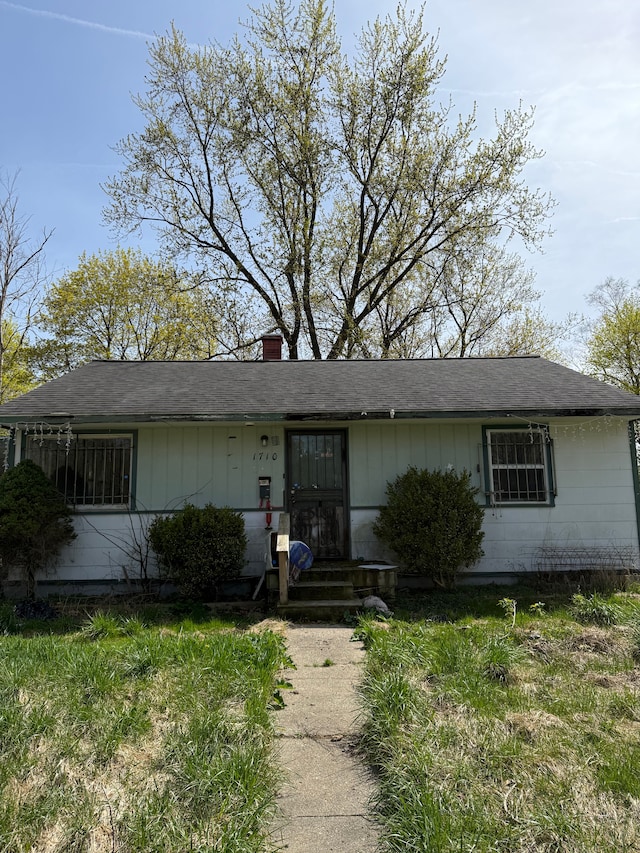 1710 Polly St, Flint, MI 48505 - ranch-style home with a chimney