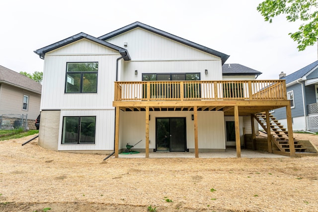 26015 E Huron River Dr, Flat Rock, MI 48134 - back of house with a wooden deck, stairway, and a patio
