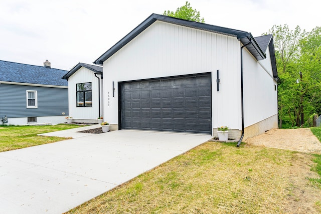 26015 E Huron River Dr, Flat Rock, MI 48134 - modern farmhouse style home featuring a garage, driveway, and a front lawn