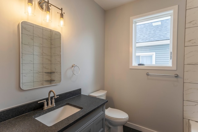 26015 E Huron River Dr, Flat Rock, MI 48134 - bathroom featuring vanity, toilet, and baseboards
