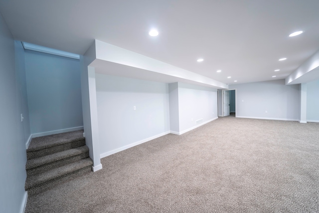 26015 E Huron River Dr, Flat Rock, MI 48134 - finished basement with carpet floors, recessed lighting, baseboards, and stairs