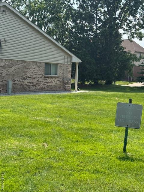 16050 Holz Dr Unit 52, Southgate, MI 48195 - view of grassy yard