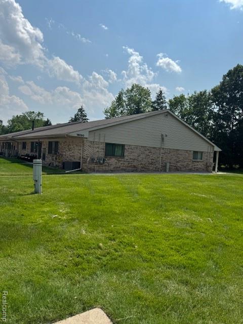 16050 Holz Dr Unit 52, Southgate, MI 48195 - view of property exterior featuring a yard