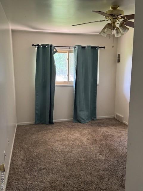 16050 Holz Dr Unit 52, Southgate, MI 48195 - carpeted spare room with a ceiling fan and baseboards