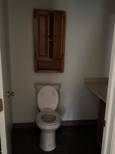 16050 Holz Dr Unit 52, Southgate, MI 48195 - bathroom featuring baseboards and toilet