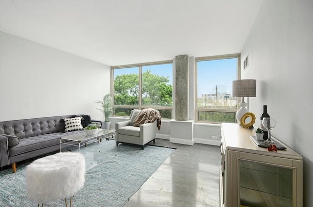 3320 Spinnaker Ln Unit 2E, Detroit, MI 48207 - living room featuring plenty of natural light, wood finished floors, and baseboards