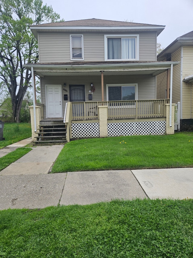 view of front facade with covered porch and a front yard