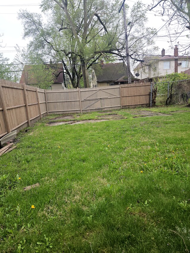 view of yard with a fenced backyard