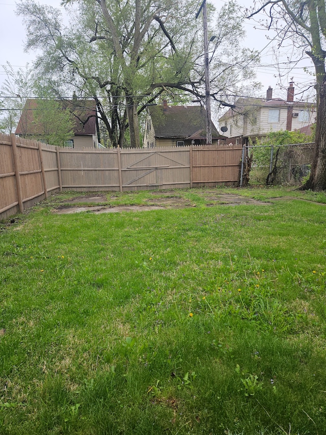 view of yard with a fenced backyard