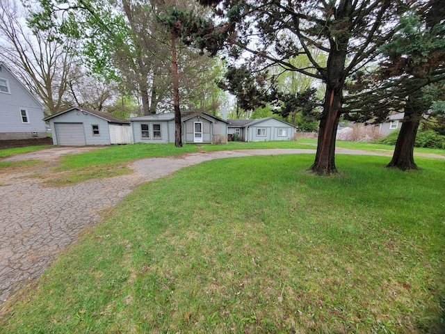 8558 Messmore Rd, Shelby Twp, MI 48317 - single story home with a detached garage, an outdoor structure, and a front lawn