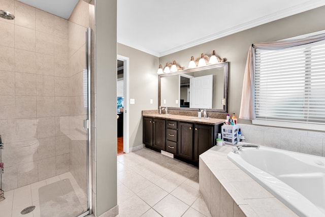 full bath with double vanity, crown molding, a shower stall, a garden tub, and tile patterned flooring