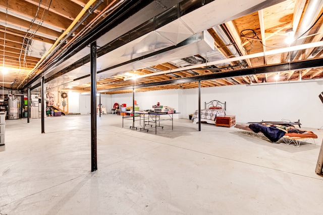 unfinished basement with gas water heater