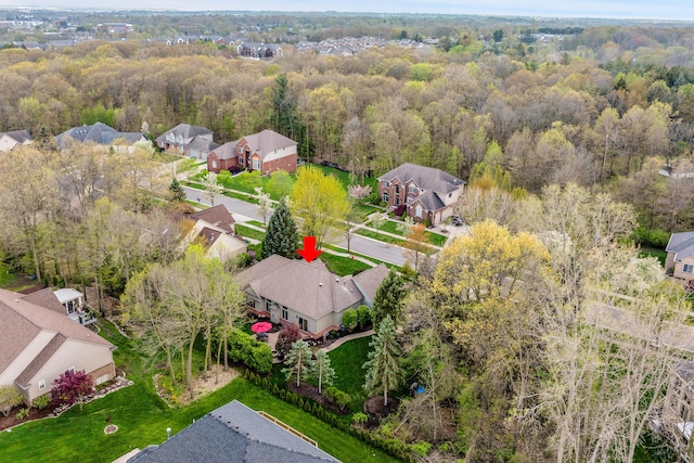 aerial perspective of suburban area featuring a forest