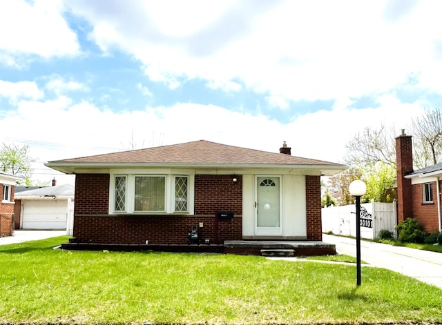 30101 Matthew St, Westland, MI 48186 - view of front of home featuring brick siding and a chimney