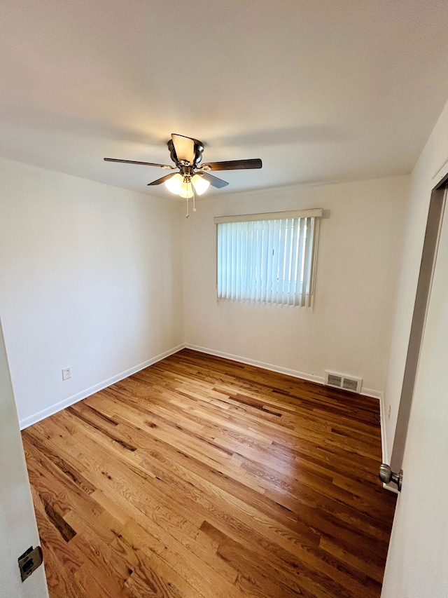 30101 Matthew St, Westland, MI 48186 - unfurnished room featuring wood finished floors, a ceiling fan, and baseboards