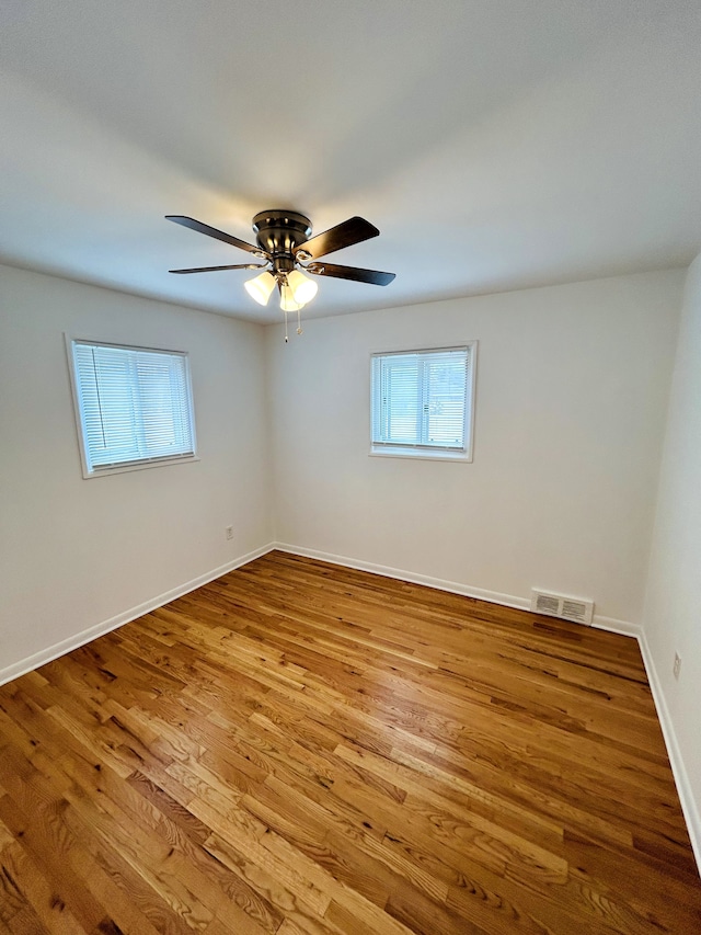30101 Matthew St, Westland, MI 48186 - empty room with ceiling fan, wood finished floors, and baseboards